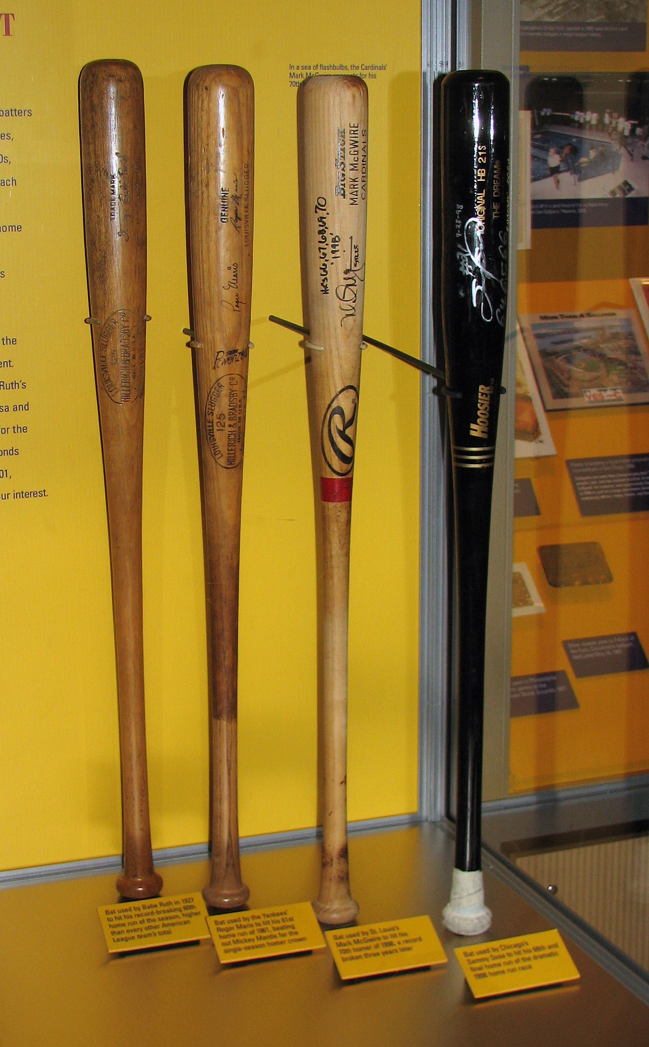Four Wooden baseball bats with pine tar